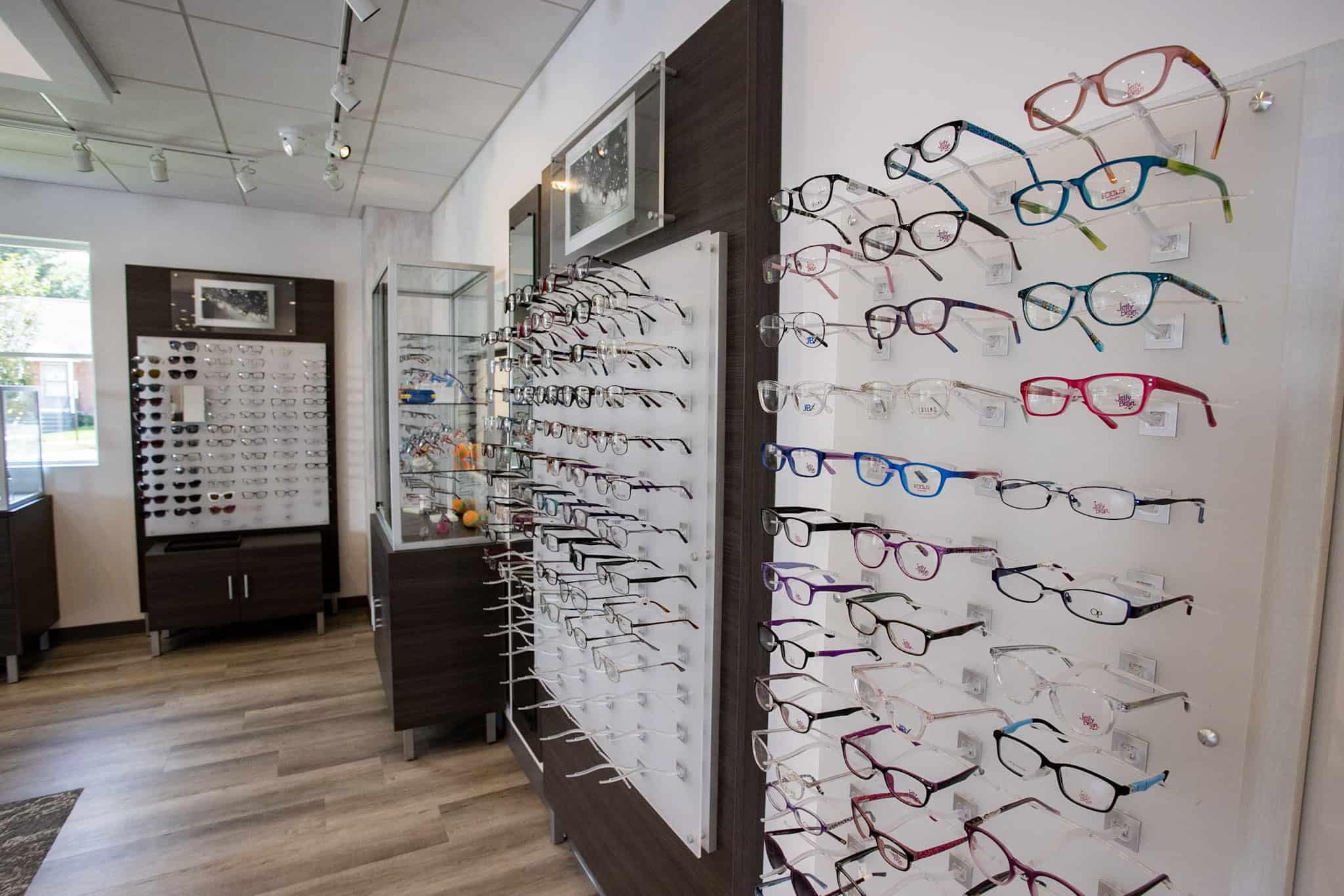 Various displays of prescription eyeglasses positioned on walls at Family Eye Care’s Bristol, CT office.